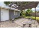 Detached garage with covered outdoor patio space perfect for entertaining guests at 6207 Main St, New Port Richey, FL 34653
