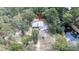 Aerial view of secluded home on a wooded lot near tranquil waterfront at 6234 Cyril Dr, Dade City, FL 33523