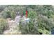 Aerial view of the property nestled amidst lush greenery, providing privacy and seclusion at 6234 Cyril Dr, Dade City, FL 33523