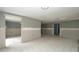 Unfinished basement featuring tiled floor and a storage closet at 6234 Cyril Dr, Dade City, FL 33523
