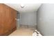 Basement featuring a mix of wood paneled and painted walls, tile flooring, needs extensive renovation at 6234 Cyril Dr, Dade City, FL 33523