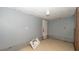 Laundry room features neutral walls and tile flooring, with space for washer and dryer, requires renovation at 6234 Cyril Dr, Dade City, FL 33523