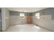 Living room showing an incomplete remodel with new flooring and unpainted drywall at 6234 Cyril Dr, Dade City, FL 33523