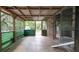 Covered patio with tiled floor, wooden frame, and sliding glass door to the interior at 6234 Cyril Dr, Dade City, FL 33523