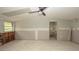 Spacious room with tile floors, a ceiling fan, and a large window providing ample natural light at 6234 Cyril Dr, Dade City, FL 33523