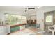 Bright room with large windows, interior renovation materials, and ceiling fan at 6234 Cyril Dr, Dade City, FL 33523