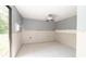 Bright room with tile floors, a door to the outside, and an air conditioning unit at 6234 Cyril Dr, Dade City, FL 33523