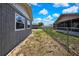 This backyard features a chainlink fence with space for a garden or patio at 6306 Aberdeen Ave, New Port Richey, FL 34653