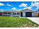 Charming home featuring a one-car garage, well-maintained lawn and fresh exterior paint at 6306 Aberdeen Ave, New Port Richey, FL 34653