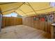 Backyard wooden deck and bar, with awning and license plate decor at 7735 Farmlawn Dr, Port Richey, FL 34668