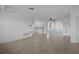 Bright, spacious living room with tile floors, ceiling fan and sliders to Florida Room at 7735 Farmlawn Dr, Port Richey, FL 34668