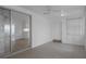 Spacious living room featuring tile flooring and an adjoining room behind sliding glass doors at 7735 Farmlawn Dr, Port Richey, FL 34668