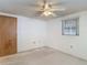 Bedroom featuring neutral walls, carpet floor, and natural light from the window at 7736 Gaston Dr, Port Richey, FL 34668