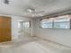 Bedroom featuring mirrored closet doors, carpet flooring, and a window at 7736 Gaston Dr, Port Richey, FL 34668