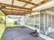 Outdoor patio and deck with a view of the yard and surrounding landscape at 7736 Gaston Dr, Port Richey, FL 34668