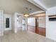 Dining area with tiled flooring, mirrored closet, and easy access to the kitchen and living room at 7736 Gaston Dr, Port Richey, FL 34668