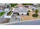 Charming exterior featuring a well-maintained front yard, convenient driveway, and an inviting screened-in porch area at 7736 Gaston Dr, Port Richey, FL 34668