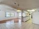 A kitchen with white cabinets, granite countertops, and tile flooring at 7736 Gaston Dr, Port Richey, FL 34668