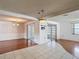 An open-concept kitchen with tile flooring and a view into the dining area at 7736 Gaston Dr, Port Richey, FL 34668