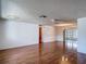 Spacious living room featuring hardwood floors and a ceiling fan at 7736 Gaston Dr, Port Richey, FL 34668