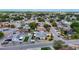Residential neighborhood view showcasing tree coverage, varied home styles, and a tranquil community ambiance at 7736 Gaston Dr, Port Richey, FL 34668
