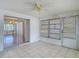 Charming sunroom featuring tile flooring, a ceiling fan, and sliding doors to other rooms at 7736 Gaston Dr, Port Richey, FL 34668