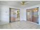 Lovely sunroom with tile floor and views into the kitchen and dining room at 7736 Gaston Dr, Port Richey, FL 34668