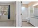 Bathroom with tile flooring, a window and vanity as seen from the bedroom at 8382 Christopher Ln, Weeki Wachee, FL 34613