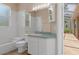 White bathroom features a tub, shower, white vanity, and mirror at 8382 Christopher Ln, Weeki Wachee, FL 34613