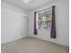 Cozy bedroom with a standard closet and natural light at 8382 Christopher Ln, Weeki Wachee, FL 34613