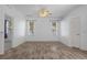Spacious room with hardwood floors, ceiling fan and generous natural light at 8382 Christopher Ln, Weeki Wachee, FL 34613