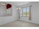 Open dining area with a window providing natural light and views of the surrounding trees at 8382 Christopher Ln, Weeki Wachee, FL 34613