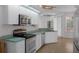 Well-equipped kitchen with stainless steel appliances and a view of the outdoor living area at 8382 Christopher Ln, Weeki Wachee, FL 34613