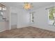 Large living room with hardwood floors and view to the kitchen at 8382 Christopher Ln, Weeki Wachee, FL 34613