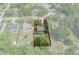 Aerial view of a residential lot with a pool, mature trees, and property line highlighted at 8402 Lake Hill Ct, Spring Hill, FL 34608