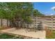 Private backyard patio with a chaise lounge and natural landscaping at 8402 Lake Hill Ct, Spring Hill, FL 34608