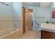 Spacious bathroom featuring tub, shower, and vanity, offering comfort and accessibility at 8402 Lake Hill Ct, Spring Hill, FL 34608