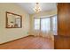 Dining area featuring a bay window, chandelier, and wood furniture at 8402 Lake Hill Ct, Spring Hill, FL 34608