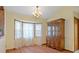 Bright dining room with a chandelier, bay window, and wood furnishings at 8402 Lake Hill Ct, Spring Hill, FL 34608