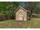 A well-built shed sits in the backyard, providing storage space for tools and garden equipment at 8402 Lake Hill Ct, Spring Hill, FL 34608