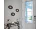 Elegant entryway featuring decorative wall accents and a decorative glass door at 8431 Ocean Tides Cv, Parrish, FL 34219