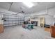 Spacious garage with epoxy floors and ample storage shelving at 8431 Ocean Tides Cv, Parrish, FL 34219