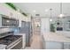 Bright kitchen featuring stainless steel appliances, granite countertops, and a stylish subway tile backsplash at 8431 Ocean Tides Cv, Parrish, FL 34219