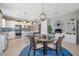 Open layout with kitchen, dining, and living area, perfect for entertaining and Gathering gatherings at 8431 Ocean Tides Cv, Parrish, FL 34219