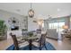 Open-concept living and dining area with stylish decor and ample natural light at 8431 Ocean Tides Cv, Parrish, FL 34219