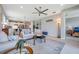 Open living room with view of kitchen, decorative elements, and open doorway to bedroom at 8431 Ocean Tides Cv, Parrish, FL 34219