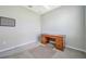 Bright office featuring neutral walls, carpet, and an elegant wooden desk at 8431 Ocean Tides Cv, Parrish, FL 34219