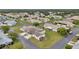 An aerial view of a well-maintained neighborhood with lush greenery and varied home styles at 9212 Estrada Pl, New Port Richey, FL 34655