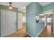 Inviting entryway with tile flooring, storage closet and views into the kitchen and hallway at 9212 Estrada Pl, New Port Richey, FL 34655