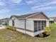 Well-maintained home exterior featuring a screened-in porch and manicured landscaping at 9212 Estrada Pl, New Port Richey, FL 34655